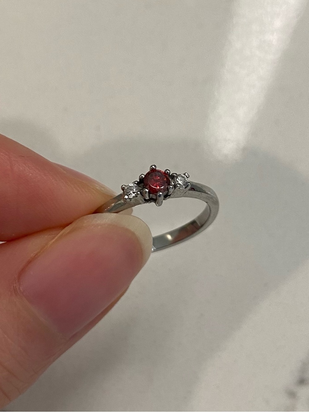 Size 3.5 titanium ring with natural garnet and white sapphire